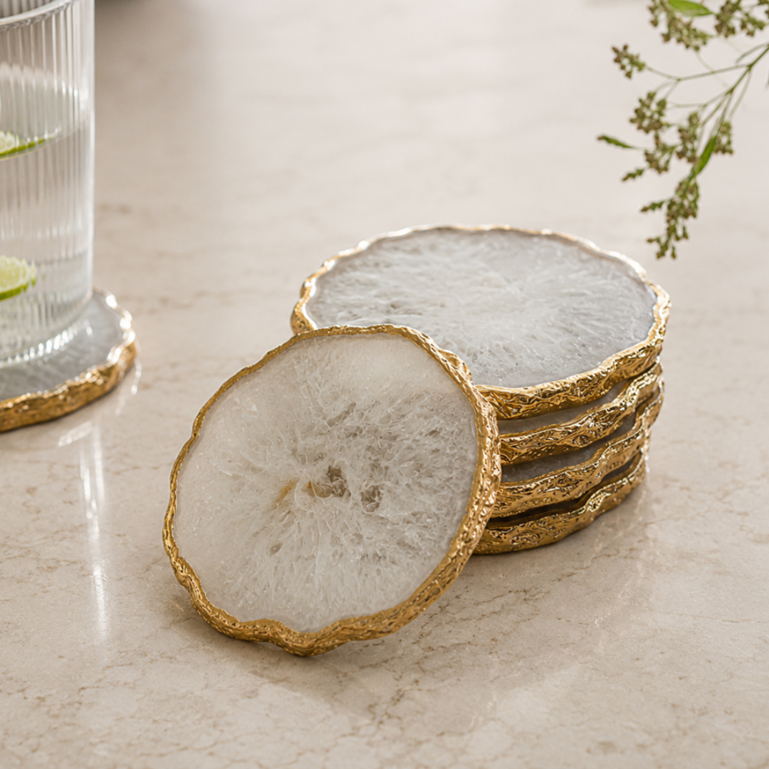 Luxury natural white agate coaster set with handcrafted gold edge for hotels, interior designers, wholesalers, importers, and hospitality projects manufactured by Sarte International.