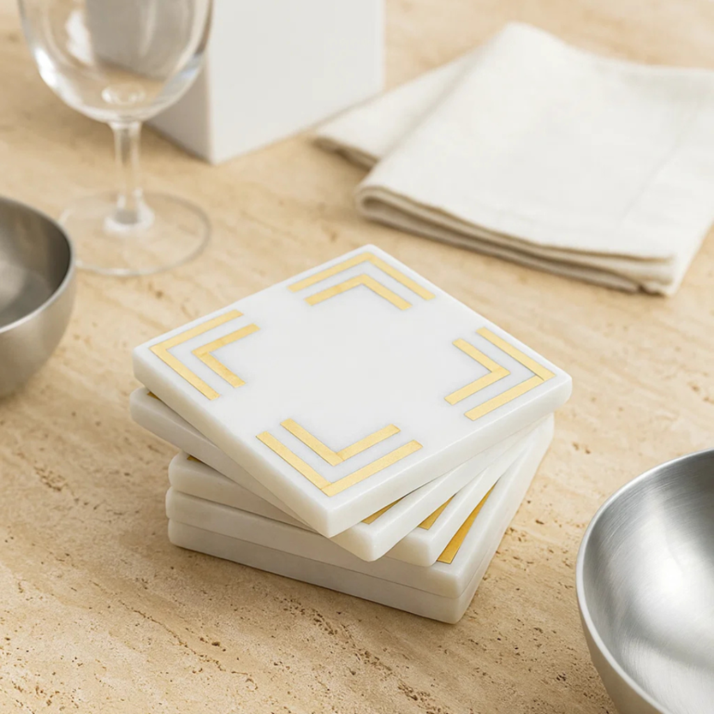 Luxury handmade white marble coaster with brass inlay geometric design for premium home, hotel, restaurant, and hospitality décor by Sarte International.